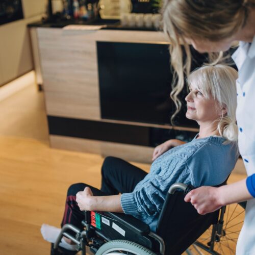 woman-with-nurse-old-age-home (1) 1